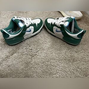 Green customized dunks.